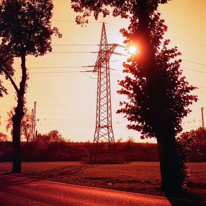 Power pole towards the sun